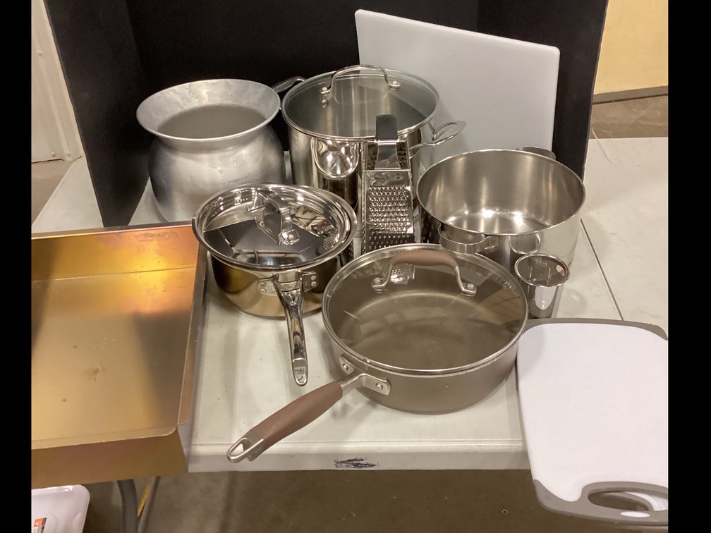 9 quart Cuisinart Pot, 4 quart Pot, 10” Skillet, 2 quart Pot, Baking Pan, Cutting Boards and Grater.