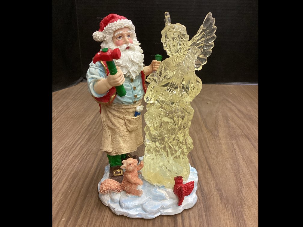 Santa Sculpting An Angel Figurine