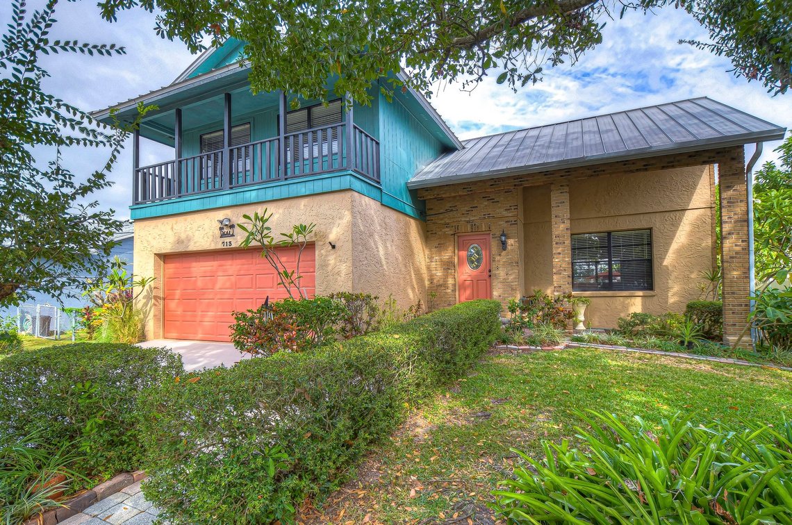 Image for For Sale ONLY at AUCTION this Waterfront 3BR/2.5BA Pool Home with Dock Just Minutes by Boat to Tampa Bay!