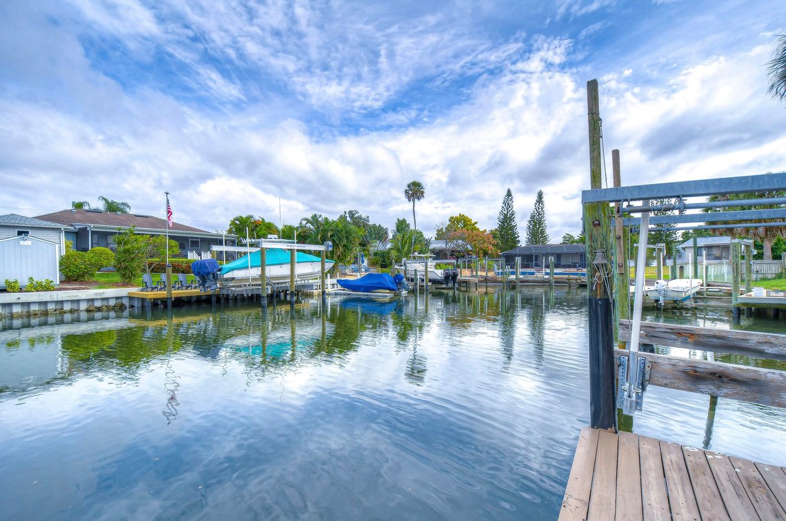Image for For Sale ONLY at AUCTION this Waterfront 3BR/2.5BA Pool Home with Dock Just Minutes by Boat to Tampa Bay!