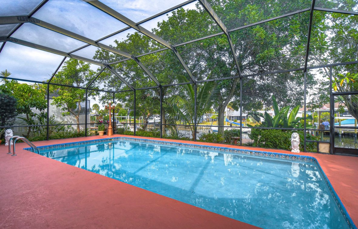 Image for For Sale ONLY at AUCTION this Waterfront 3BR/2.5BA Pool Home with Dock Just Minutes by Boat to Tampa Bay!
