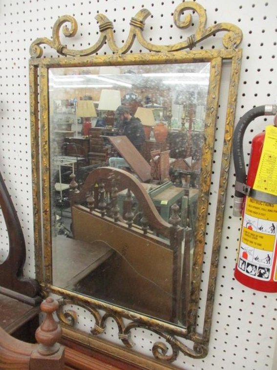 Beveled edge mirror in metal frame