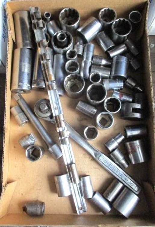 Box of Craftsman 1/2" drive sockets, ratchet and extensions