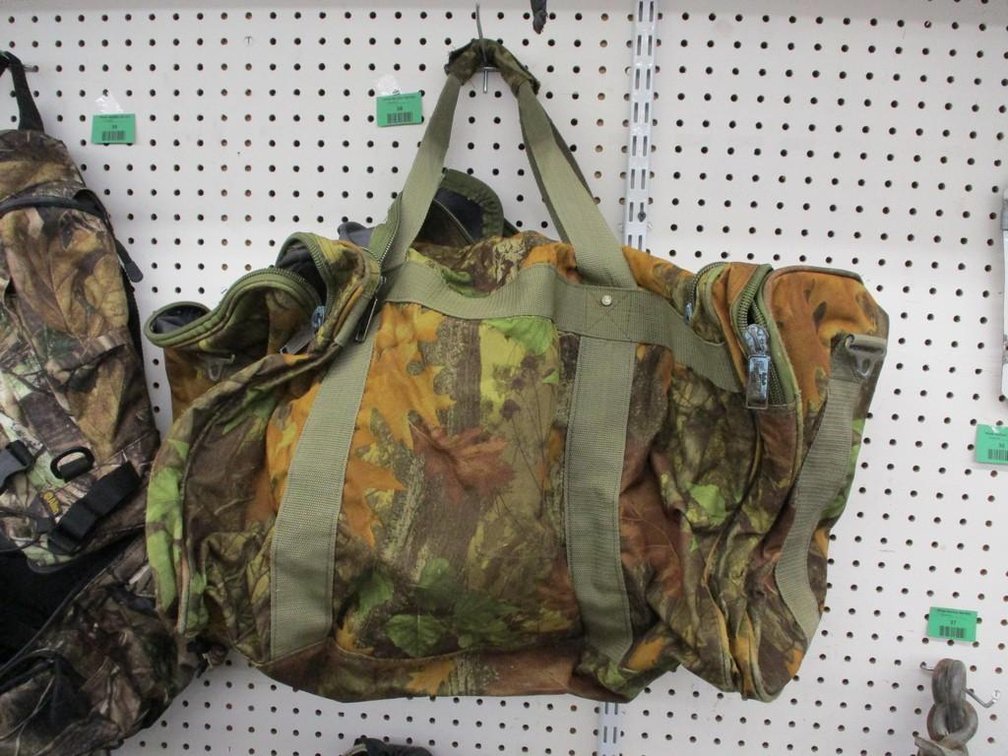 Magnum camo duffle bag with contents