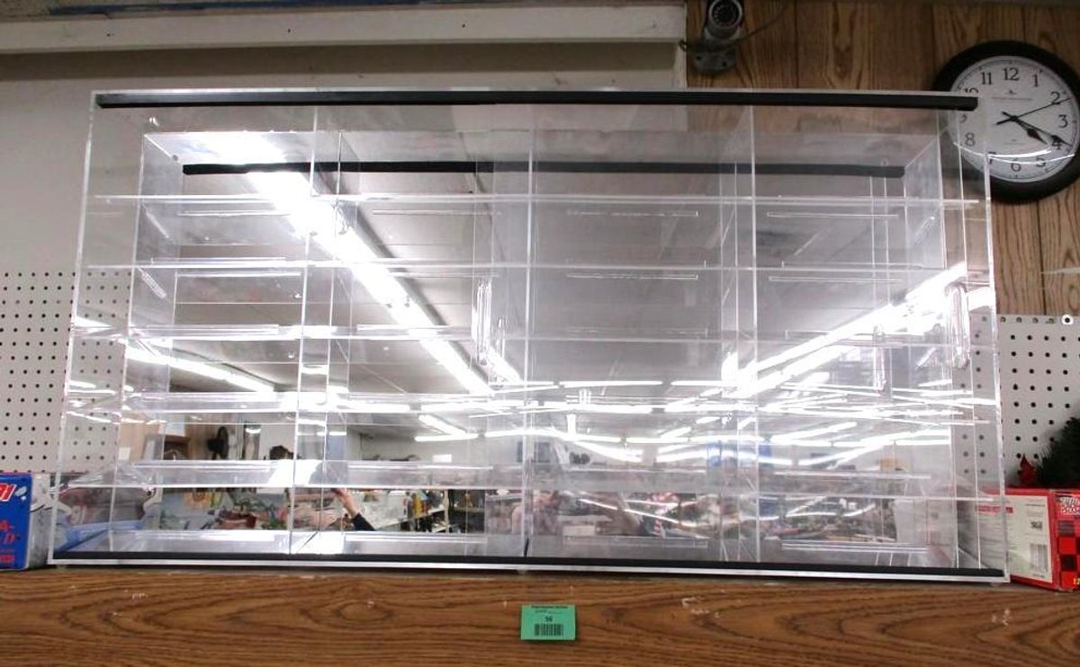 Plastic display case with two front sliding doors