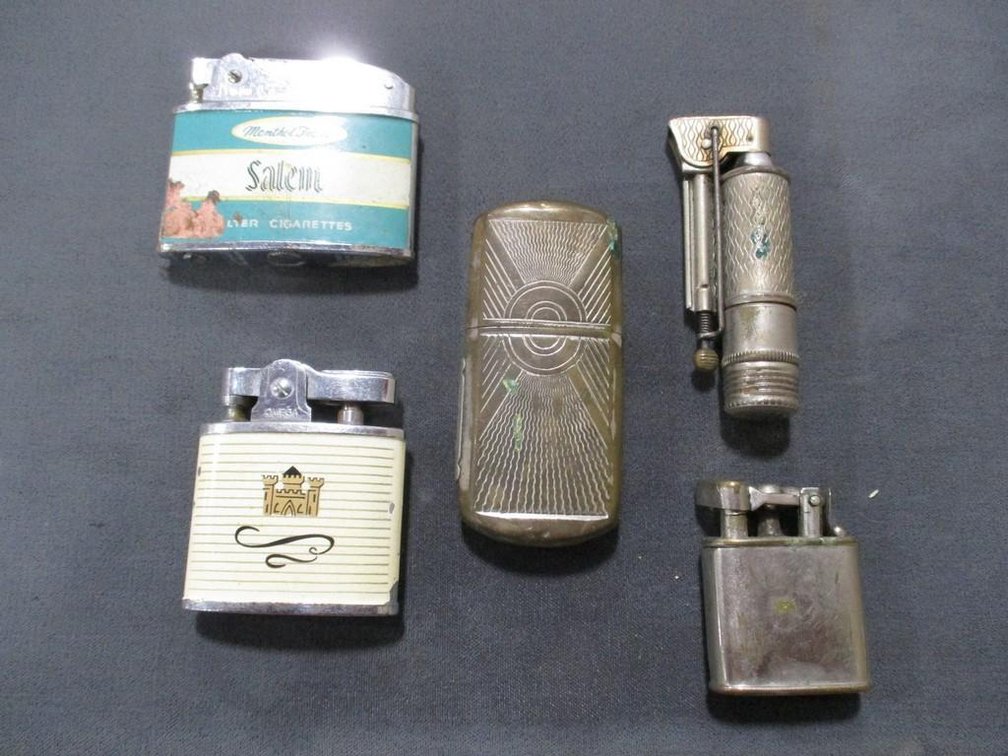 (4) Vintage lighters and (1) match holder