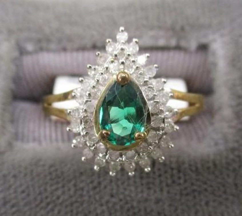 10k 6 x 4 pear cut emerald 1/5 CTTW diamond ring
