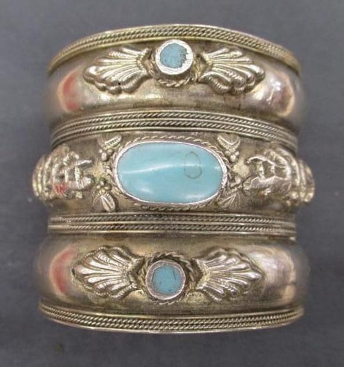 Silver tone cuff bracelet with turquoise accent stones