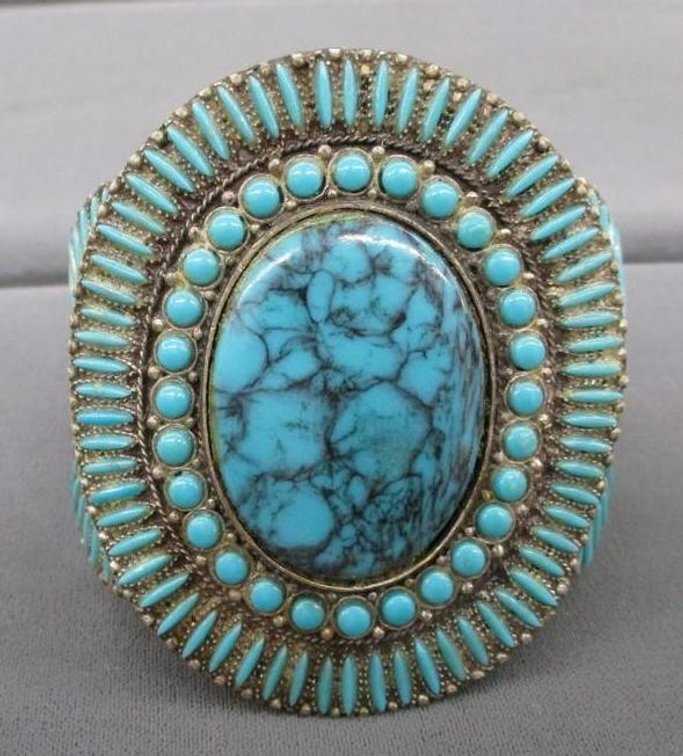 Silver tone cuff bracelet with turquoise tone stones