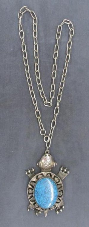 Silver tone turtle pendant with turquoise accent necklace