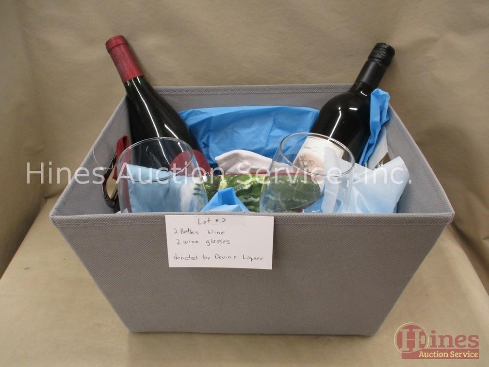 Box containing bottled wine and glasses