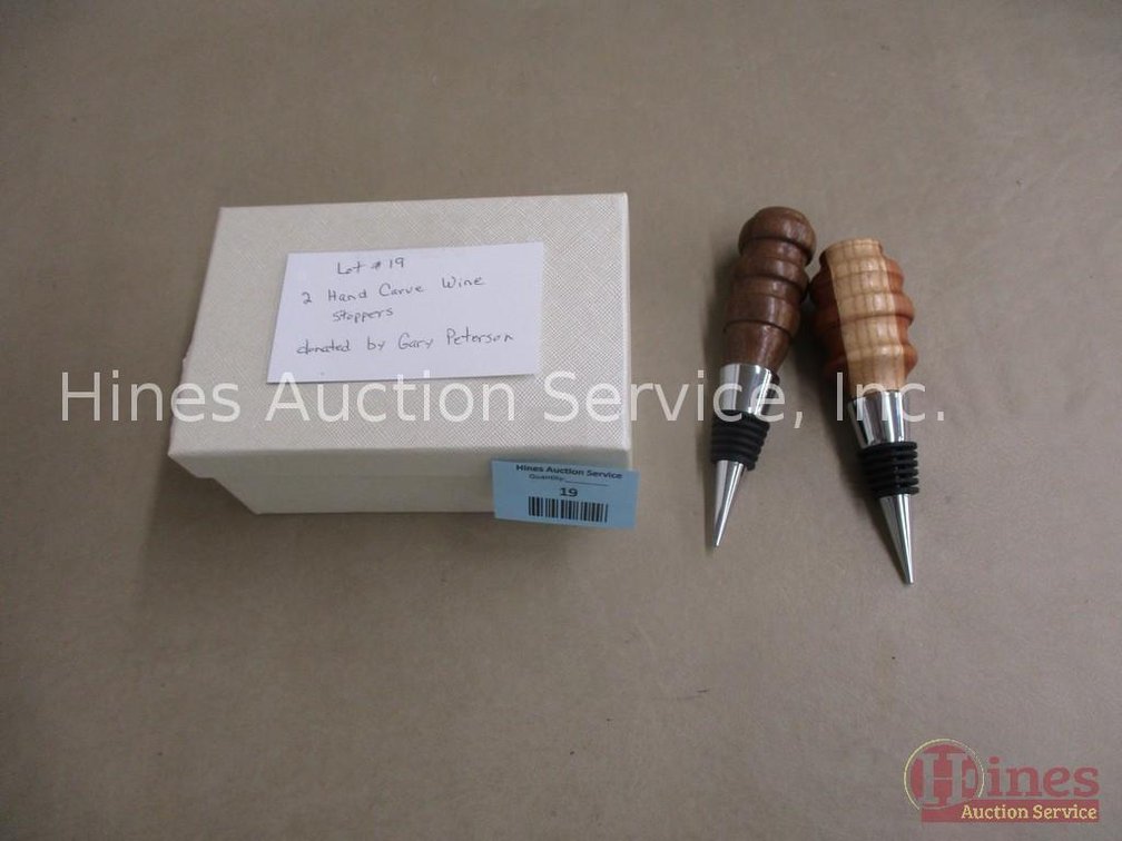 (2) Hand carved wooden wine stoppers