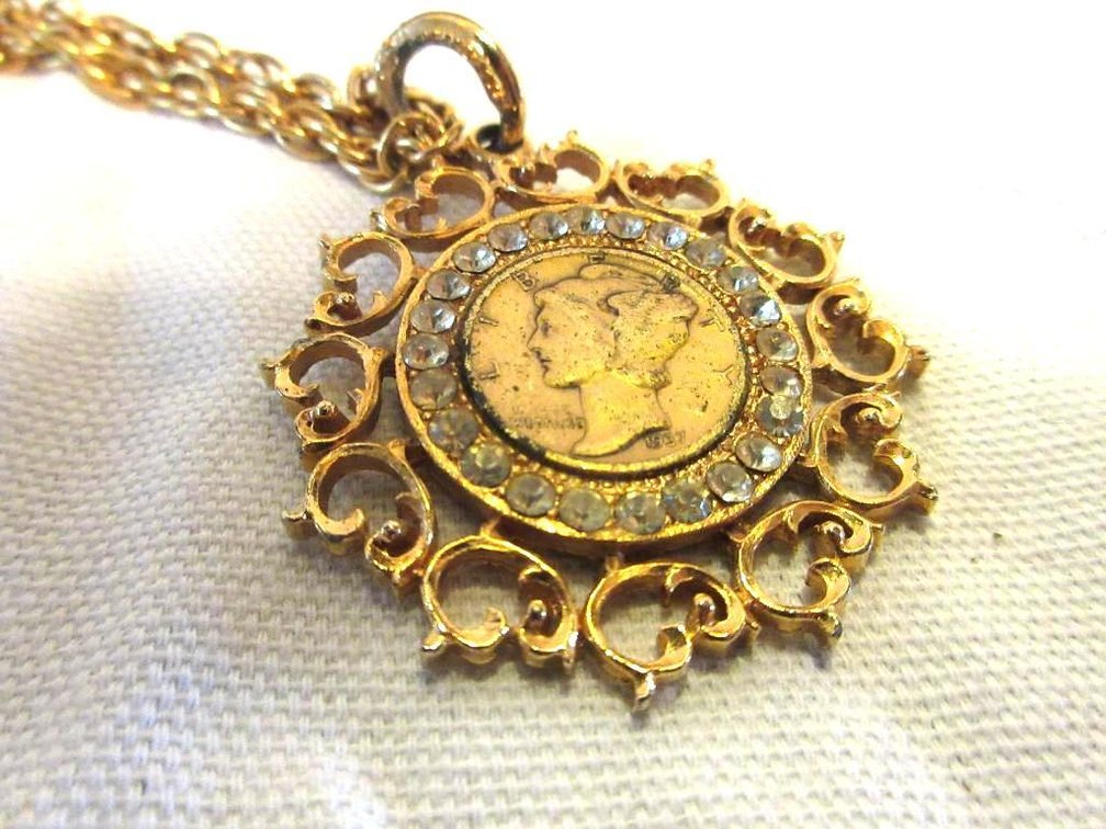 Gold plated mercury dime in pendant on chain