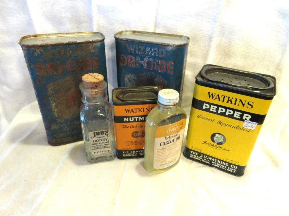 Group of vintage tins and bottles