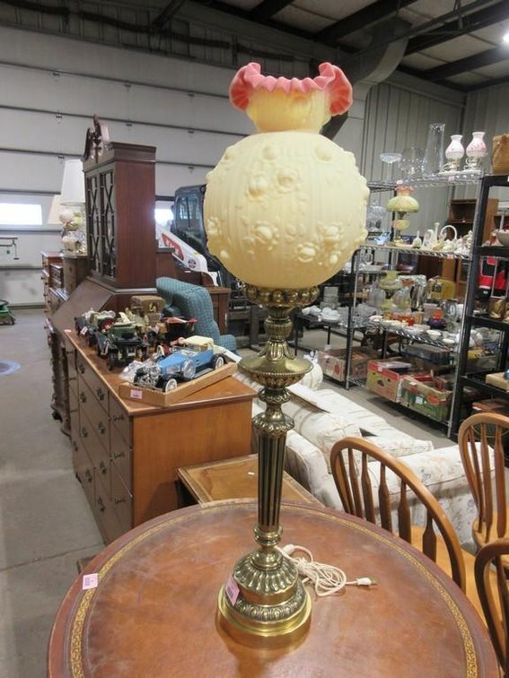 Ornate metal base table lamp with Fenton yellow/pink glass shade