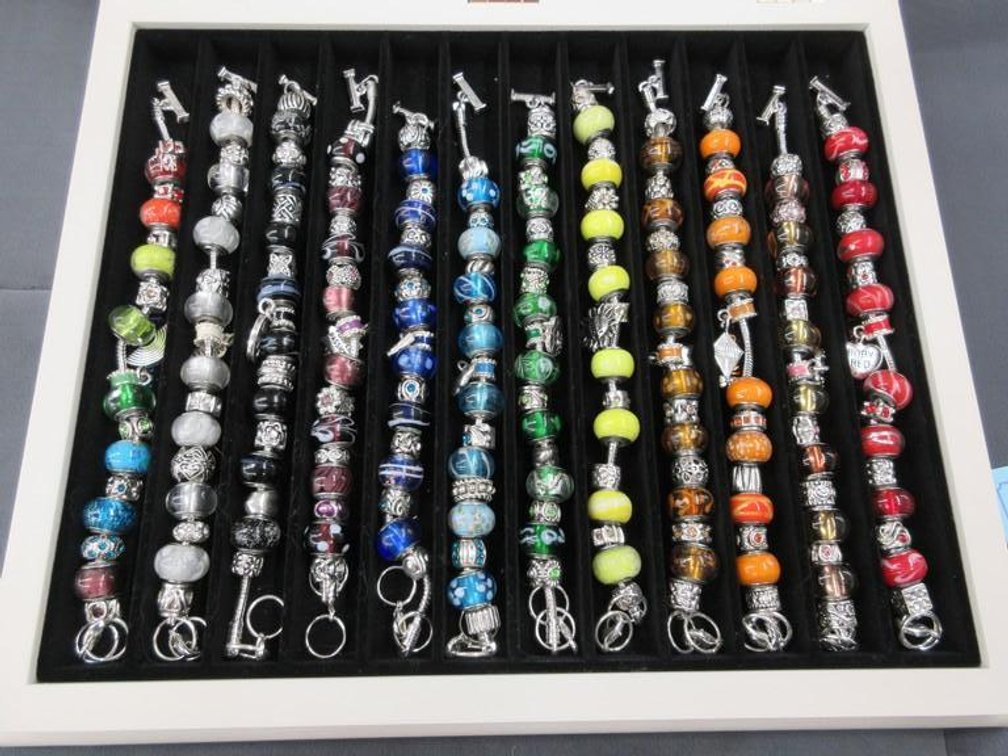 Set of 12 coloured bead bracelets