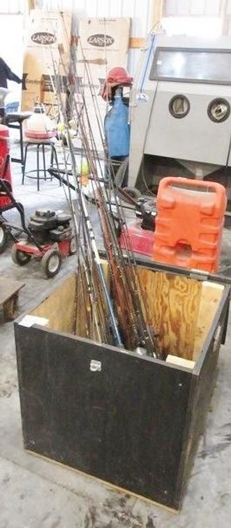 Wood box with contents of fishing poles