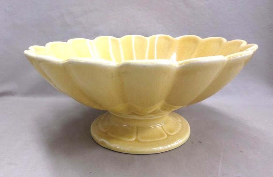 Yellow glazed shell shaped footed compote