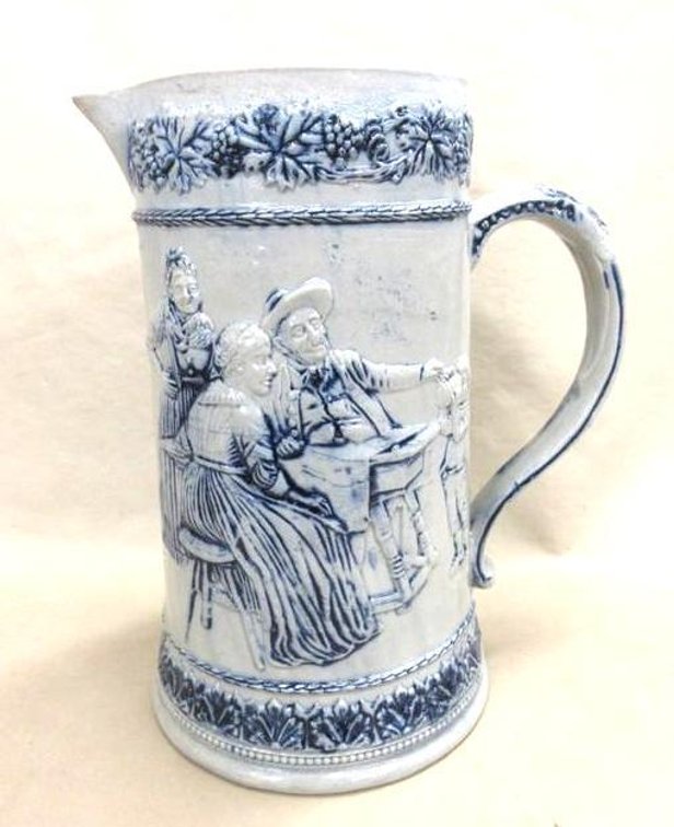 Bottom marked "5" stoneware pitcher with Renaissance theme on sides