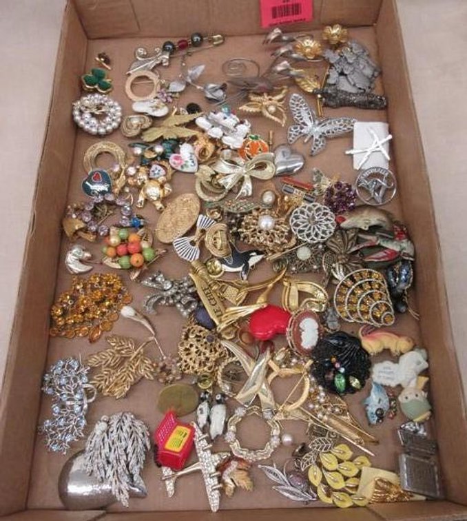 Flat of pins and brooches