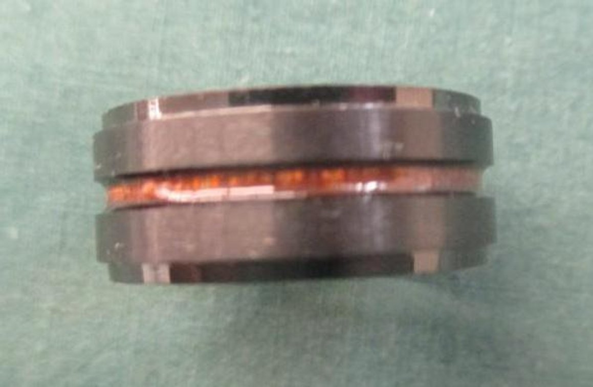 Black metal ring with brown accent stripe