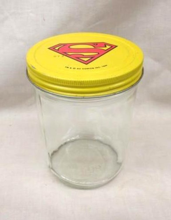 Vintage glass peanut butter jar with Superman lid