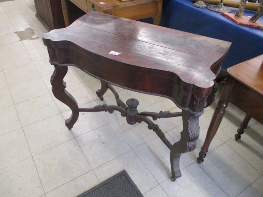 Antique carved-leg game table