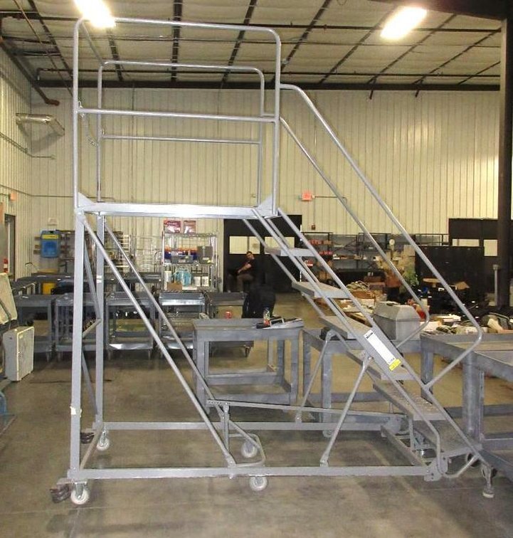 Tri Arc 6-wheel rolling warehouse ladder with oversized platform