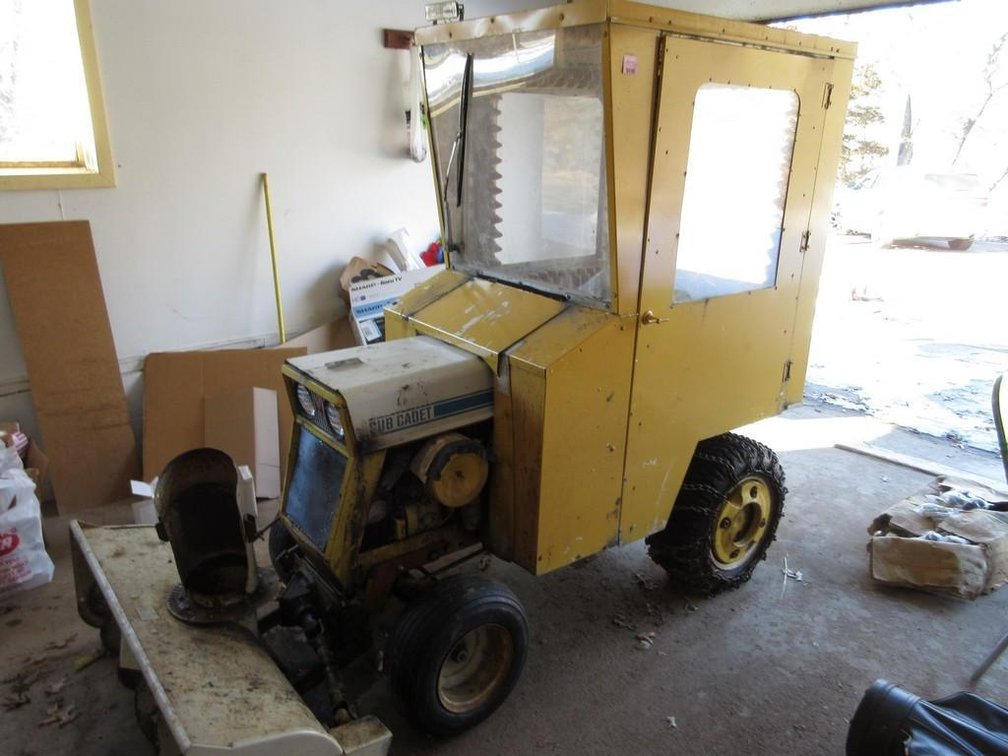 International Cub Cadet 104 lawn tractor with cab, bower and mower deck (unknown running condition)
