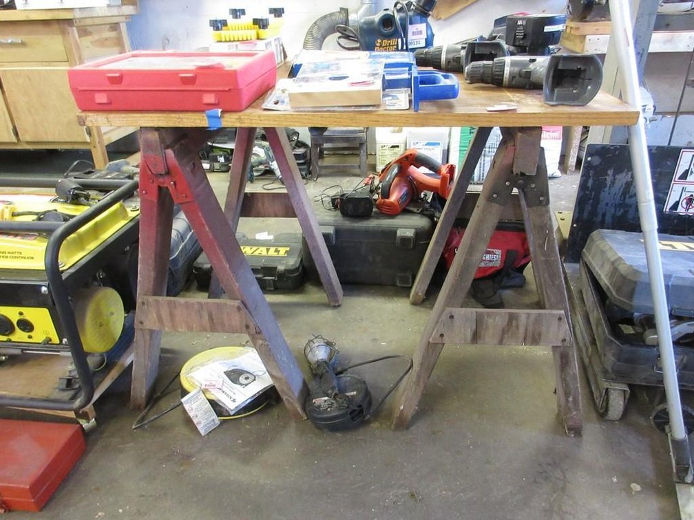 Pair of saw horses and wood plank