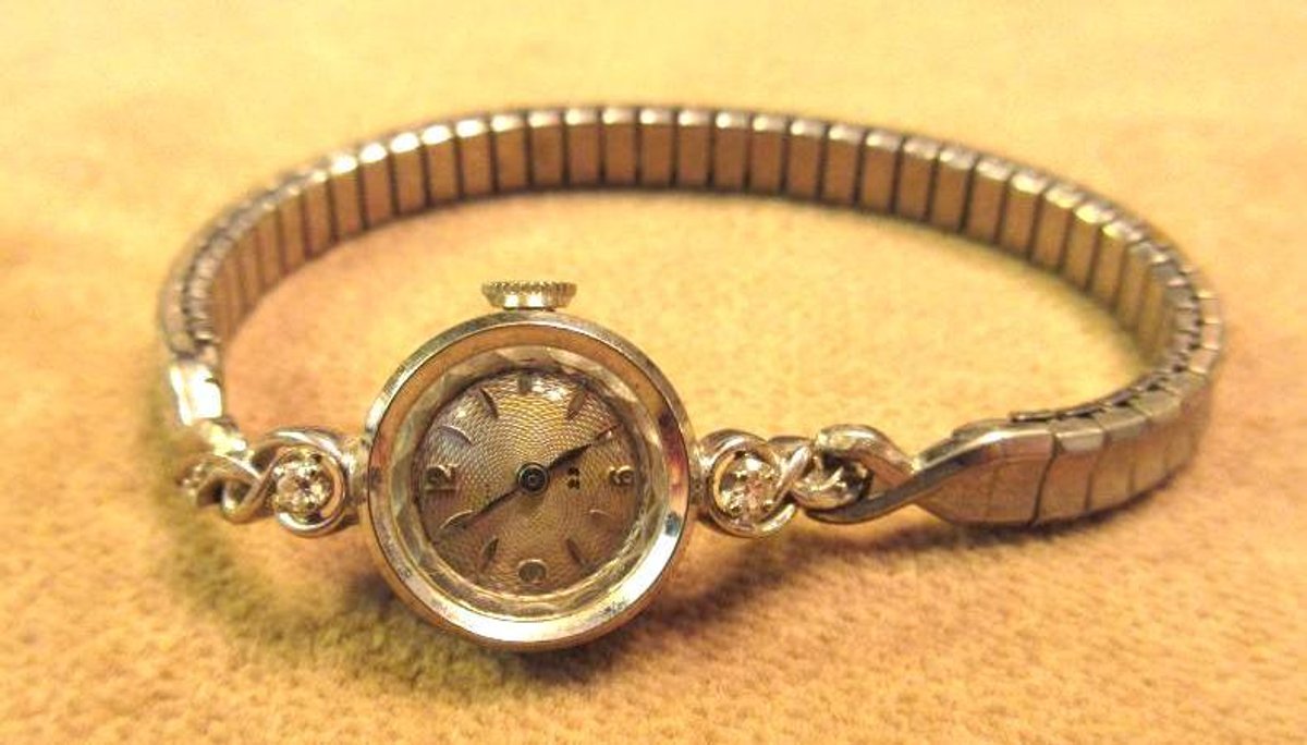Bulova 14K white gold watch with small diamonds
