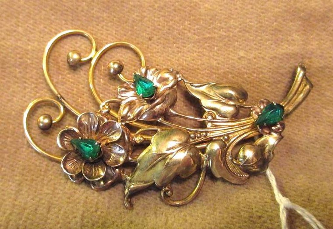 Sterling gold plated floral broach with green stones