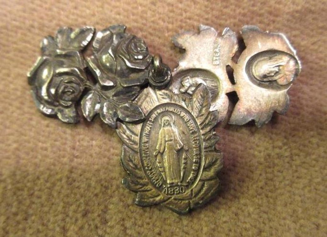 Sterling swivel religious pendant