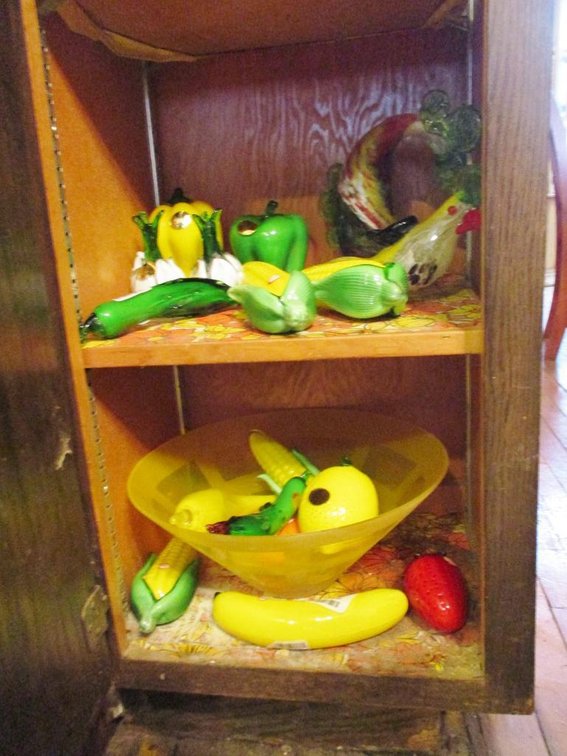 Glass bowl with glass fruits and vegetables (parrot is loose from base)