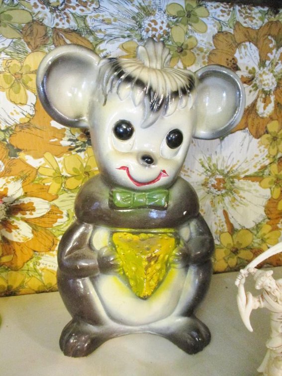 Ceramic mouse bank with money inside