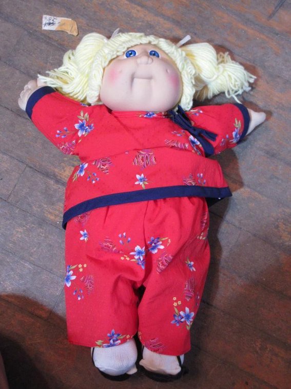 Vintage Cabbage Patch Kids doll in oriental clothing