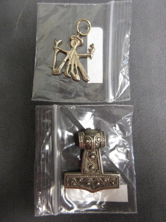 (2) Marked sterling B.E. Nelson pendants