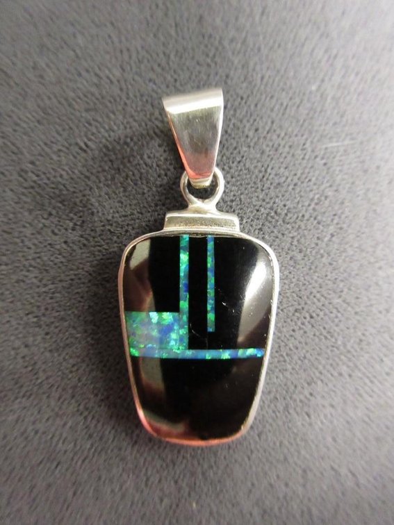 Sterling silver pendant with opal and onyx accent
