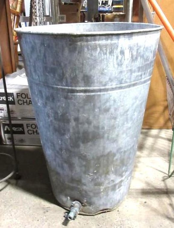 Galvanized tin pail with spout on bottom
