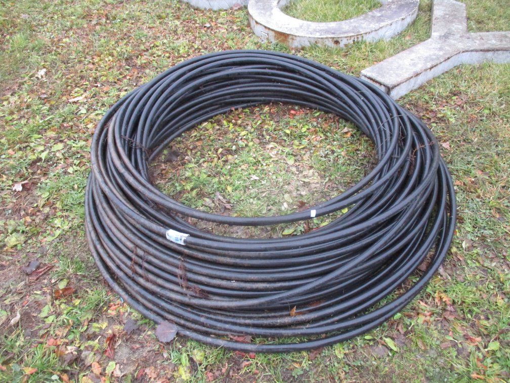 Roll of plastic garden hose