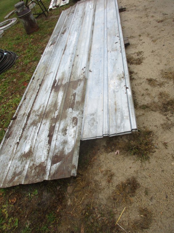 Group of galvanized steel pole shed siding