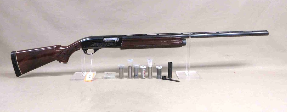 Remington model 1100 12-gauge magnum semi auto shotgun (subject to transfer fee)