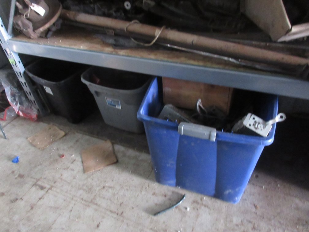 Group of auto parts on floor