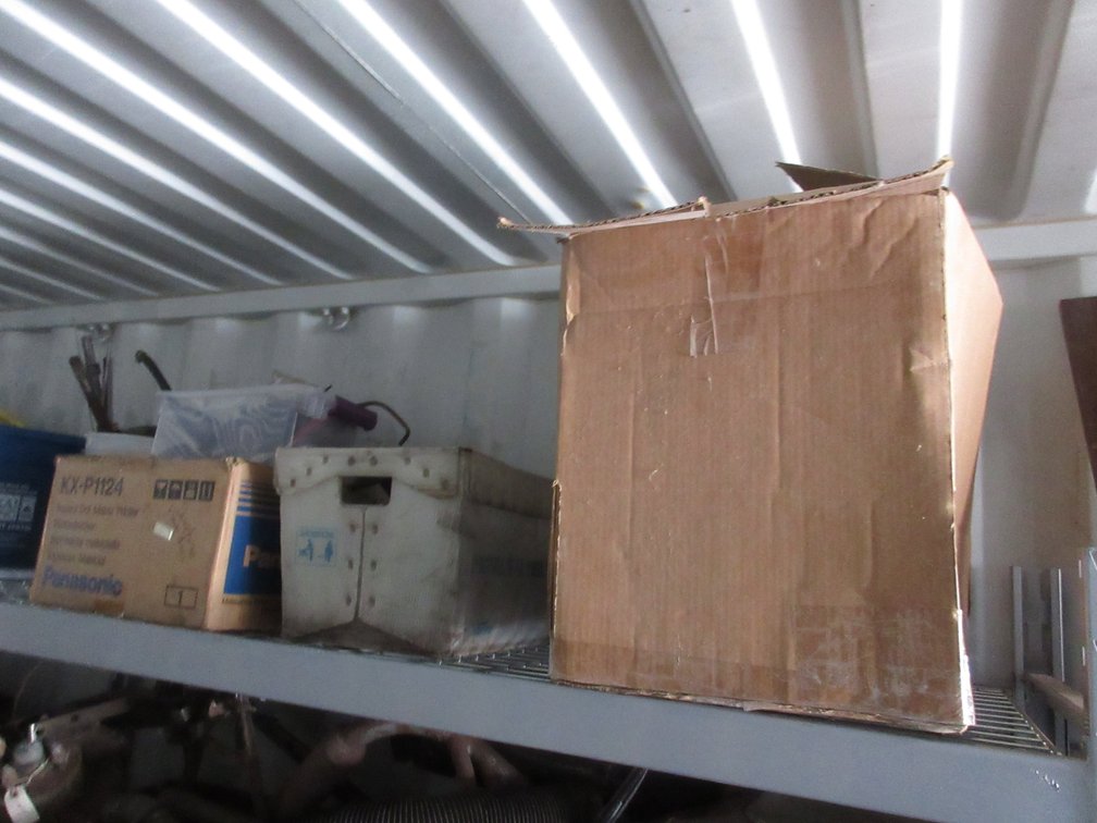Group of auto parts on shelf
