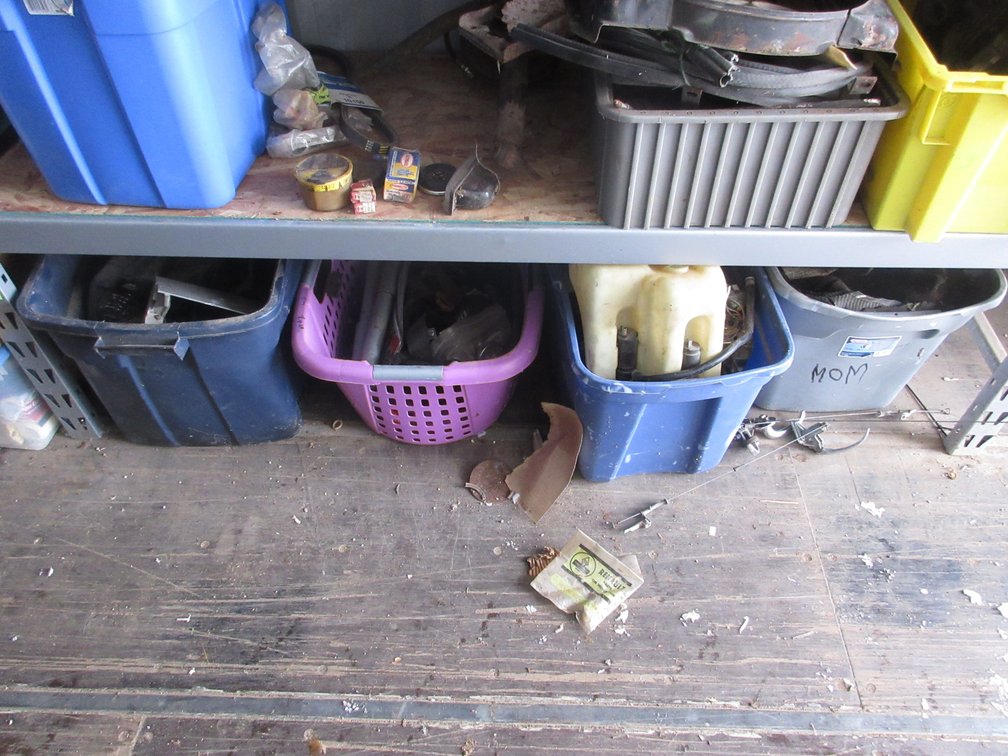 Group of auto parts on floor