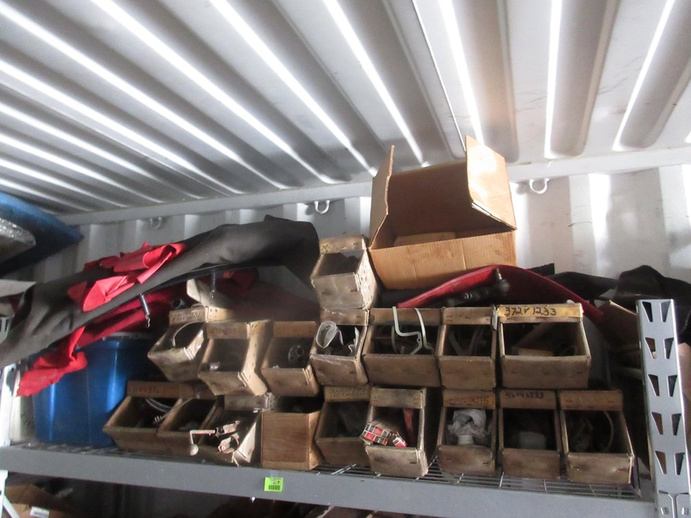 Group of auto parts on shelf