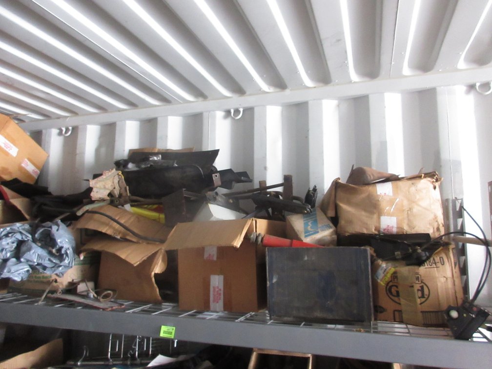 Group of auto parts on shelf