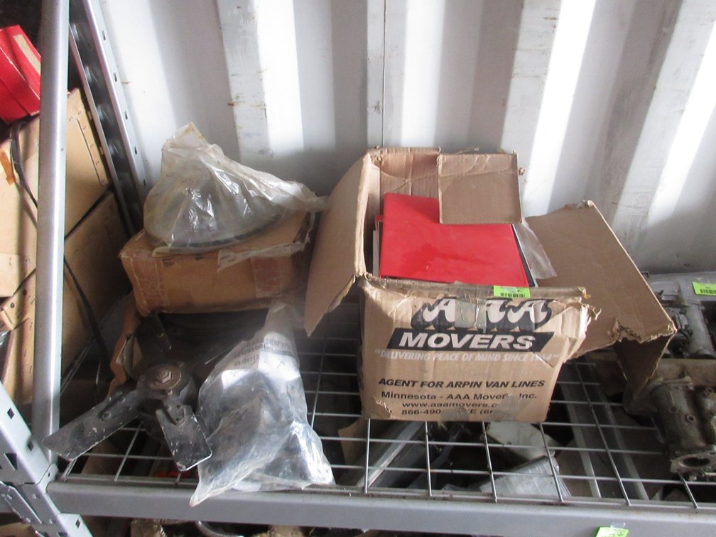 Group of auto parts and manuals