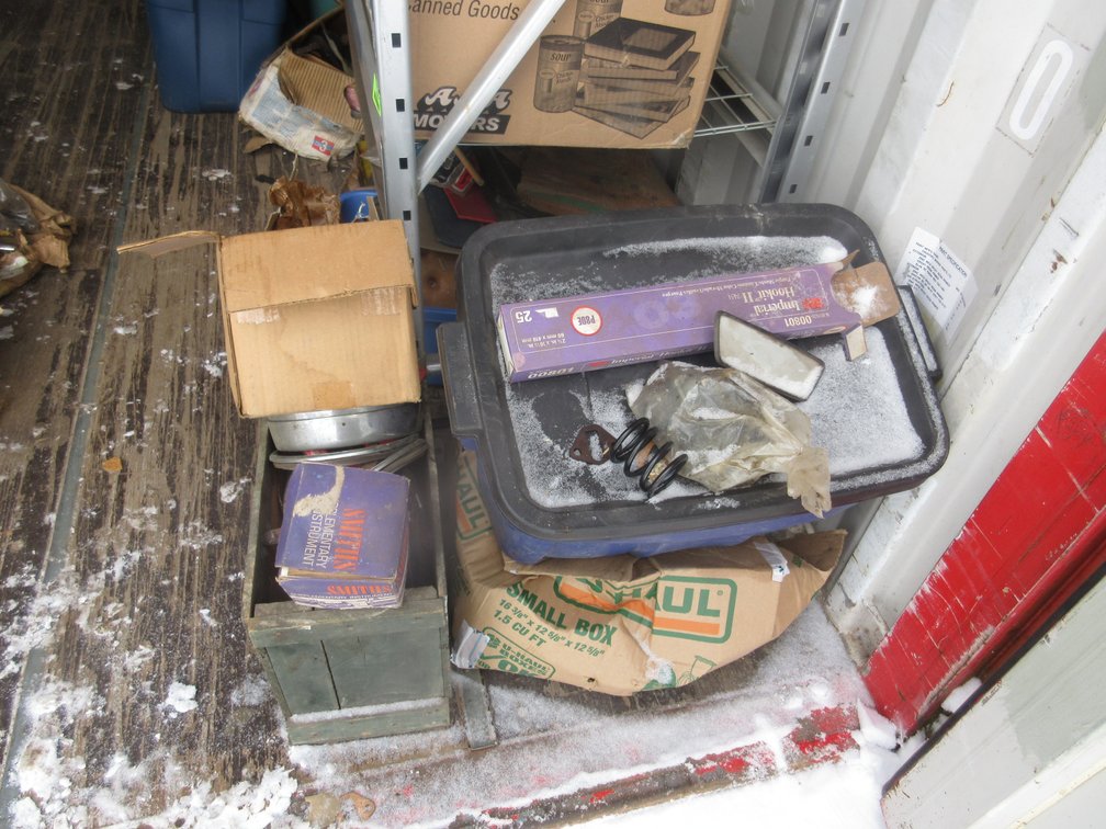 Group of auto parts on floor