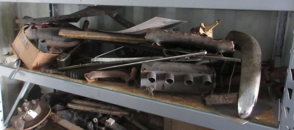 Group of auto parts on shelf